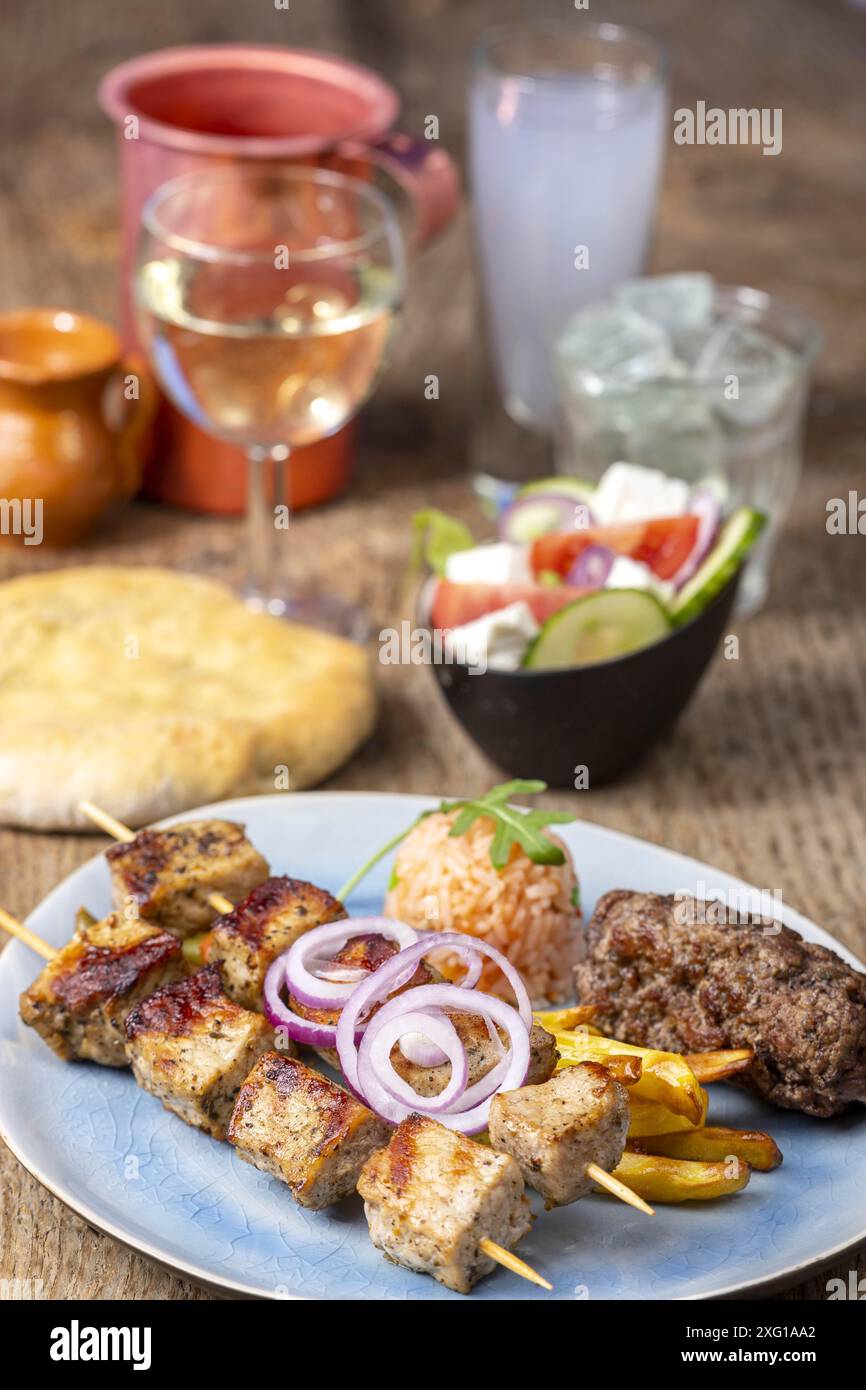 Greek souflaki skewers with chips Stock Photo - Alamy