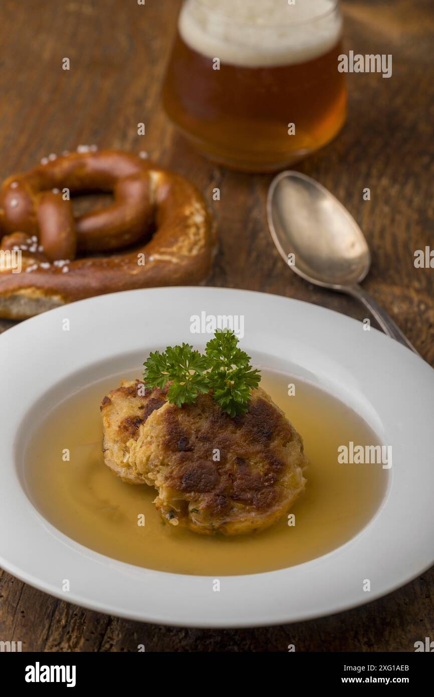 Austrian cheese dumplings in broth Stock Photo