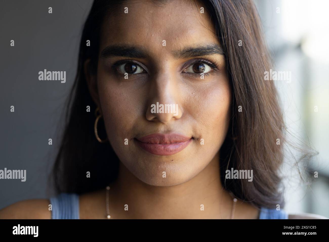 Wearing long earrings hi-res stock photography and images - Alamy