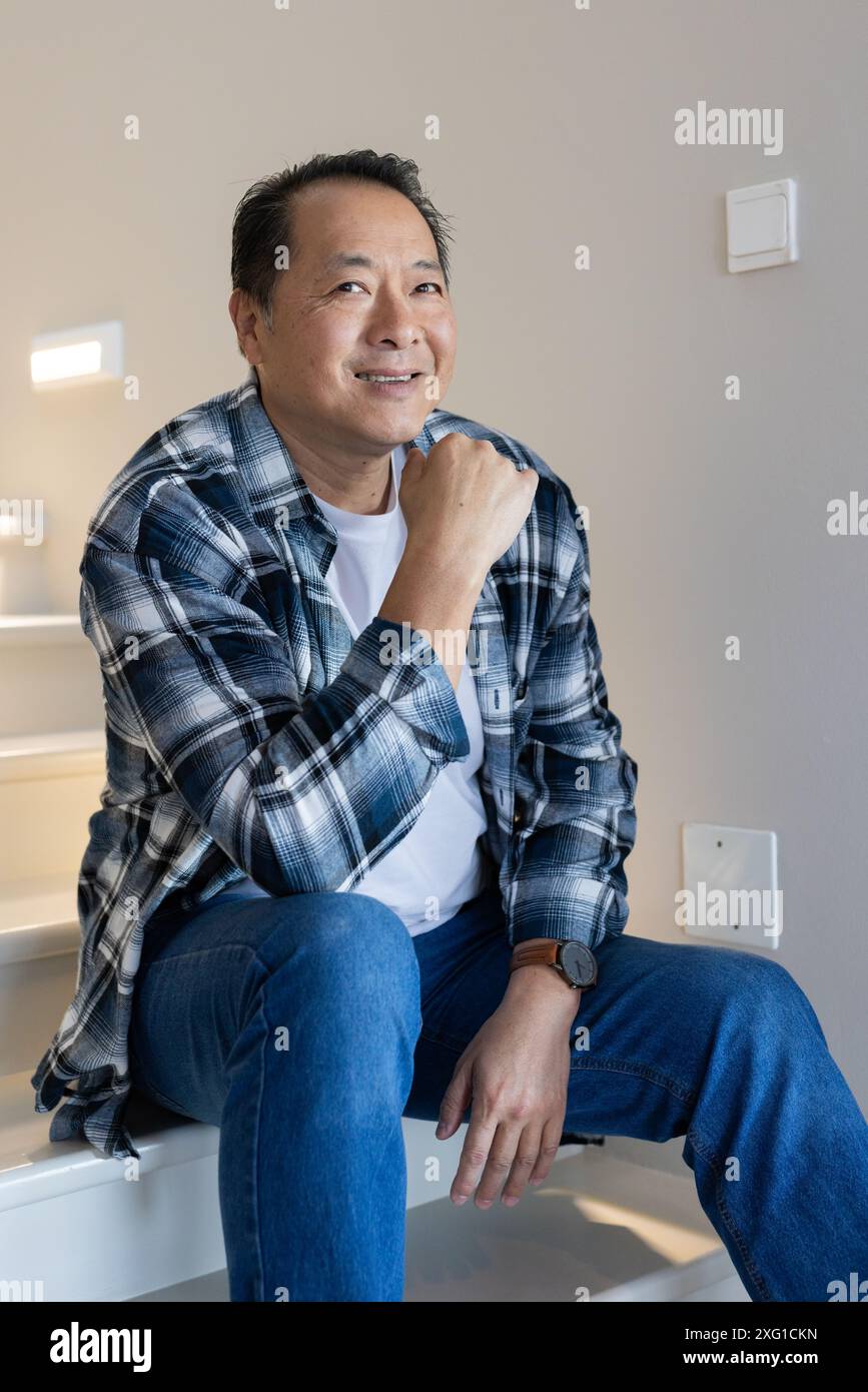 Senior man sitting on stairs hi-res stock photography and images - Alamy