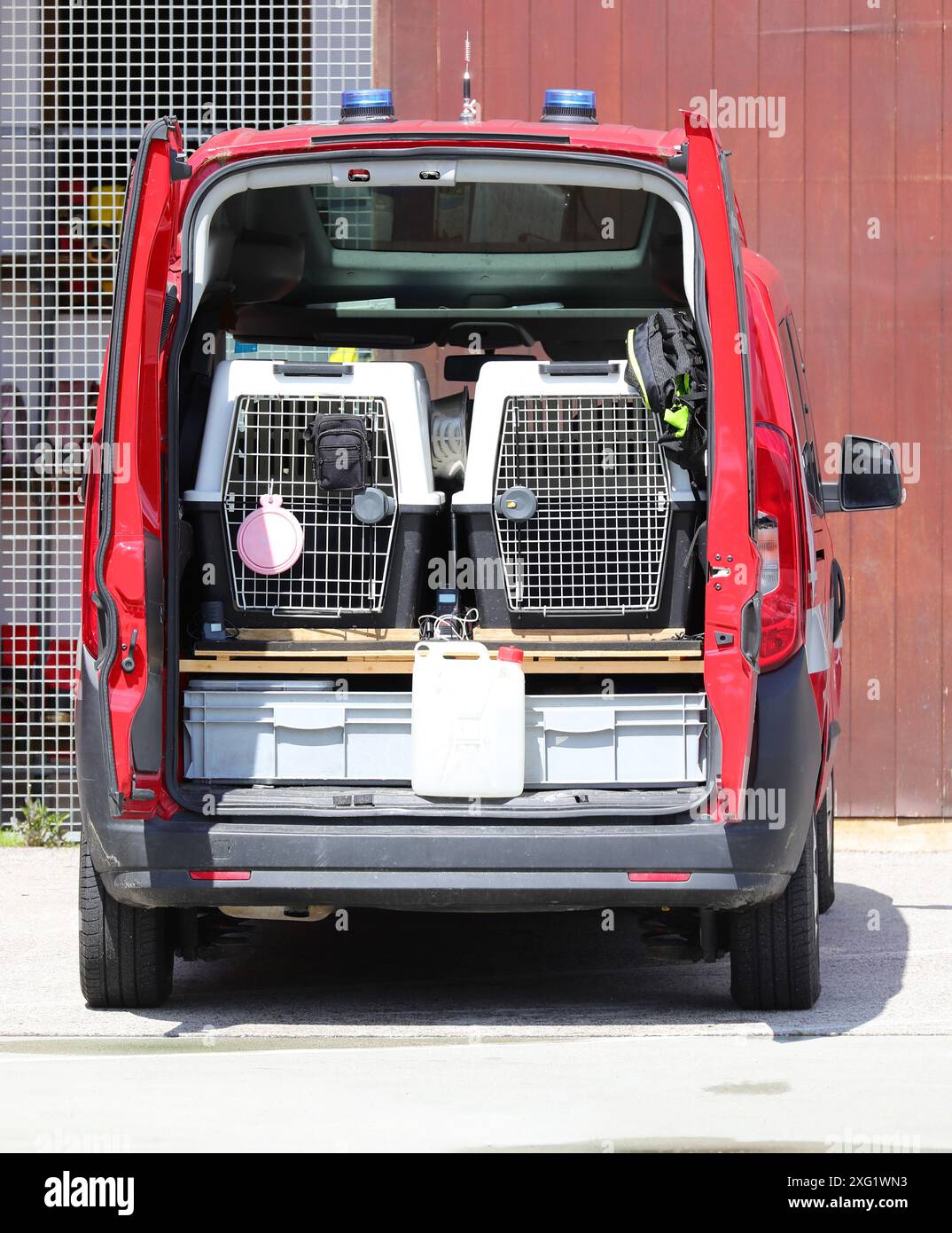 K-9 unit van transporting canine units during law enforcement raids on ...