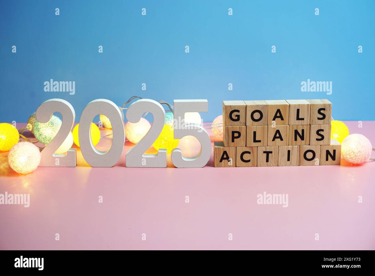 2025 new year goals, plan, action alphabet letters on blue and pink background Stock Photo Alamy