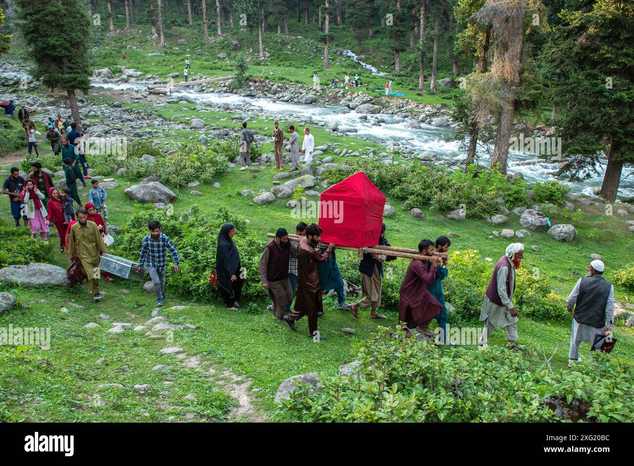 Gujjar (nomad) men carry a bride in the traditional palanquin as they ...