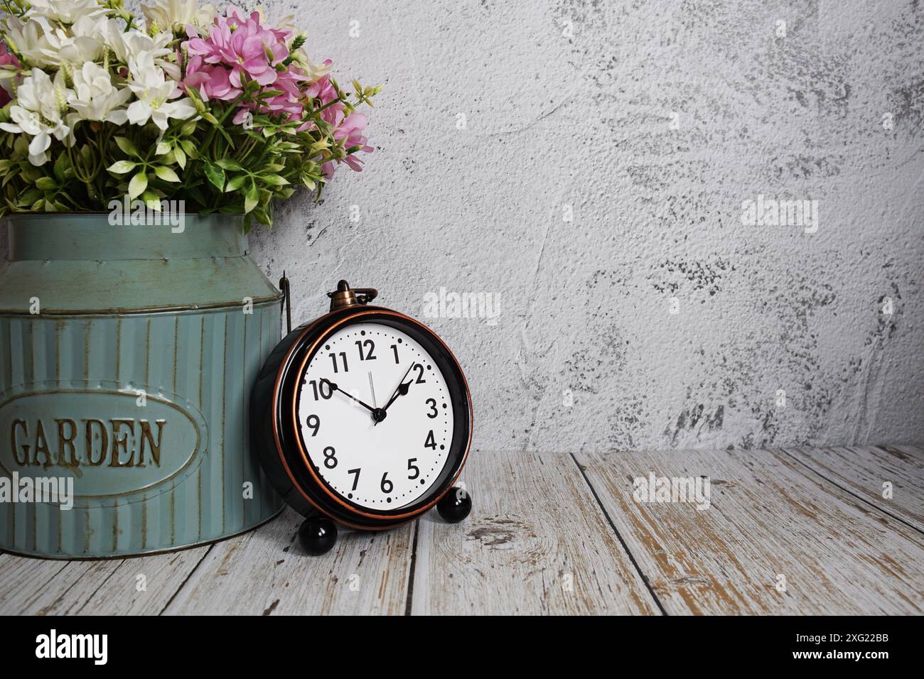 Vintage alarm clock with space copy on concrete wall background Stock ...