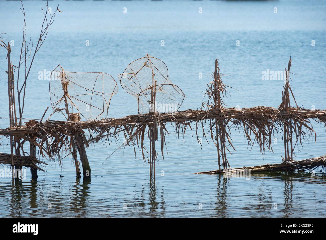 Rasheed, Egypt. 27th June, 2024. Reed fish traps and metal cages a ...