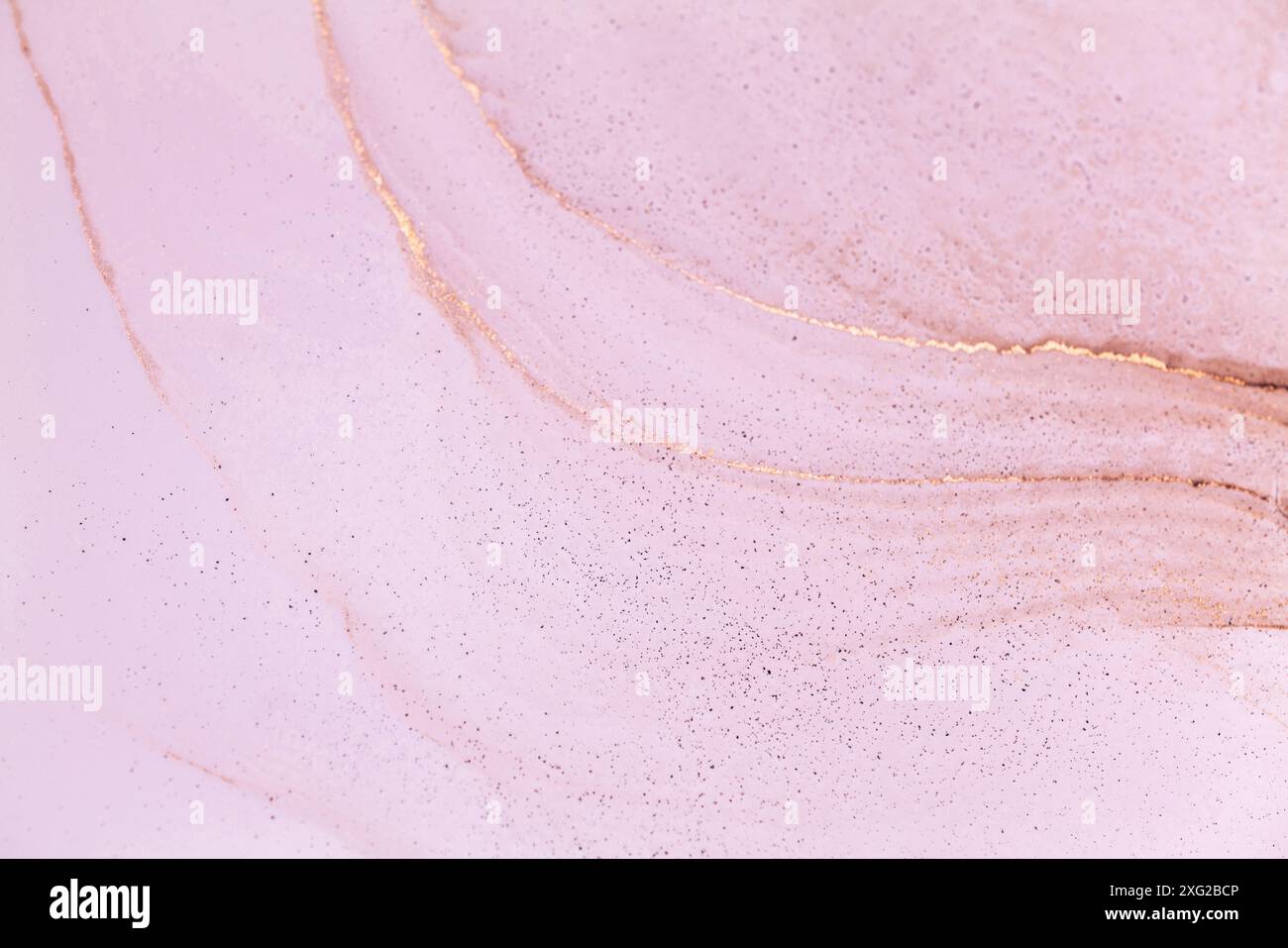 A close-up photograph of an abstract art piece featuring a pink background with delicate, shimmering gold veins Stock Photo