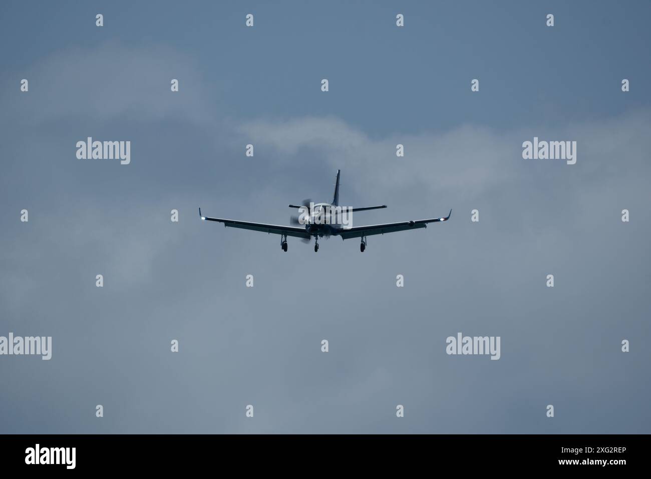 Single-engined turboprop airplane in the cloudy sky Stock Photo - Alamy