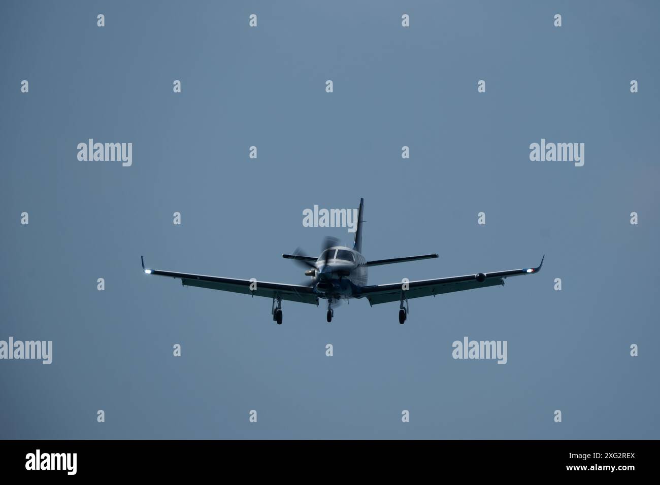 Single-engined turboprop airplane in the cloudy sky Stock Photo - Alamy