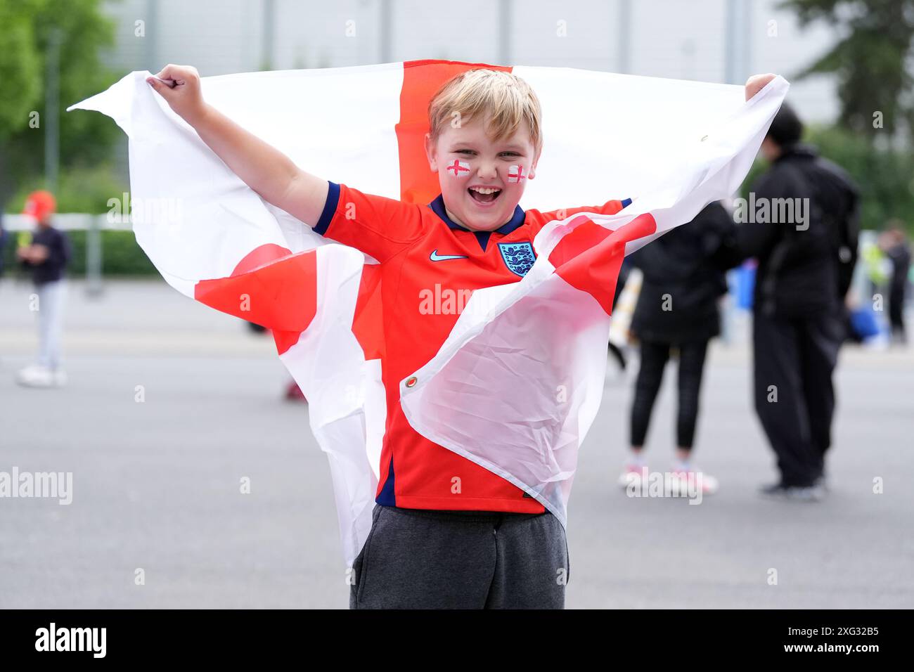 A young England fan holds up an England flag ahead of the UEFA Euro ...