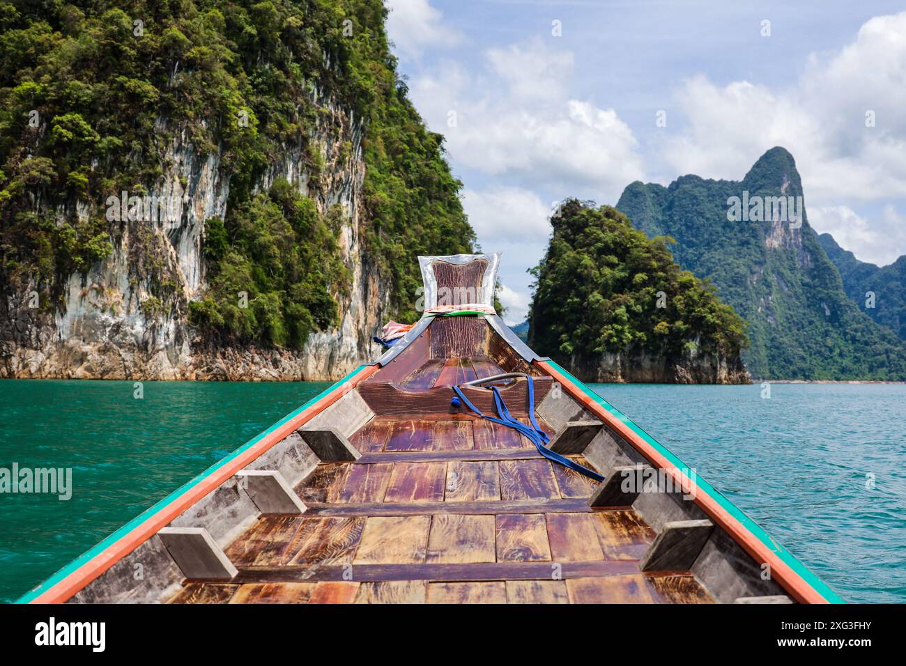 View from the boat bow to rock islands on Cheo Lan lake at Surat Thani province of Thailand. Picturesque landscape of national Khao Sok park Stock Photo