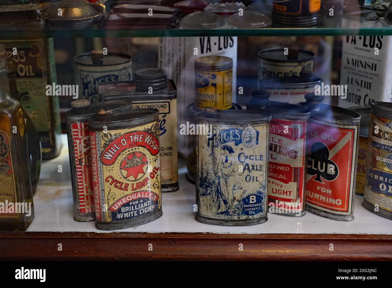 Beamish museum. Durham, UK. Oil and petroleom containers in 1920's garage. Stock Photo