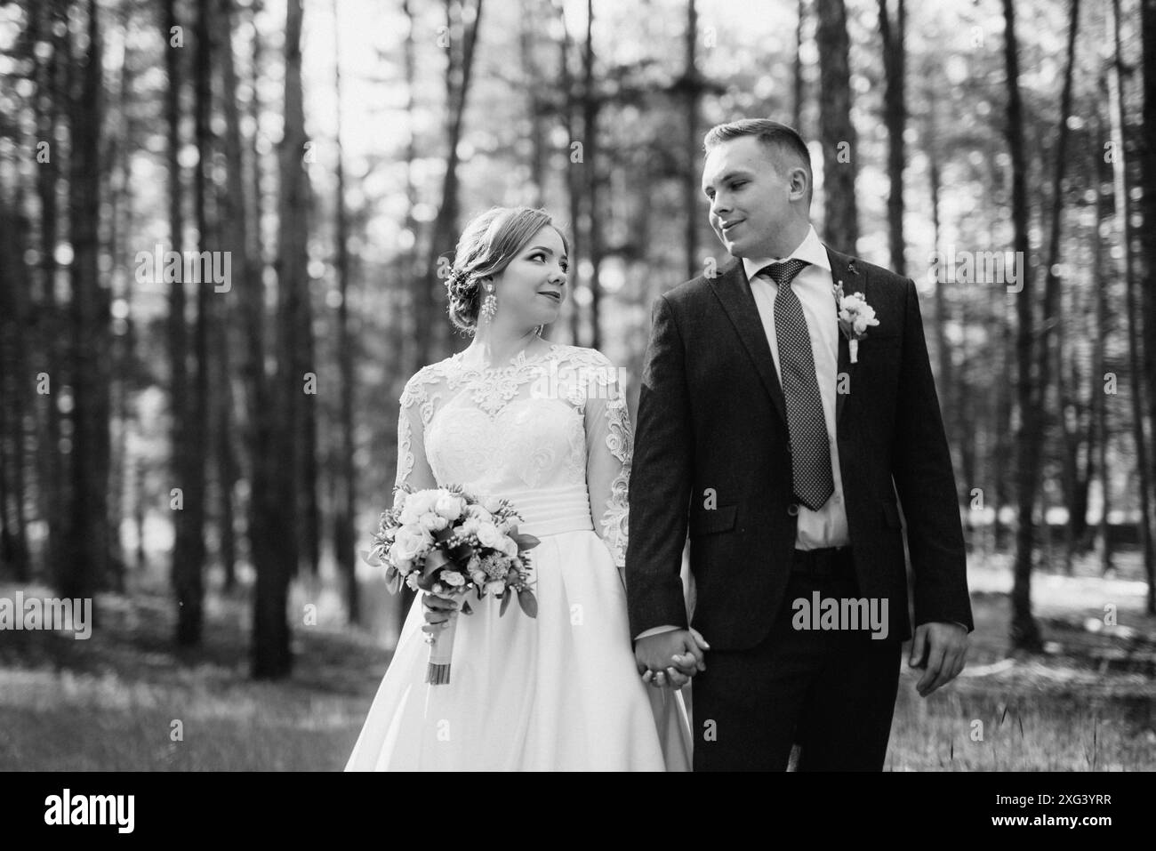Bride groom walking in pine hi-res stock photography and images - Alamy