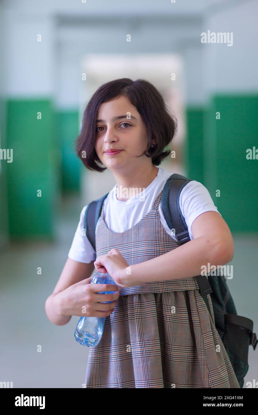 Beautiful girl in a school corridor posing for the camera Stock Photo ...