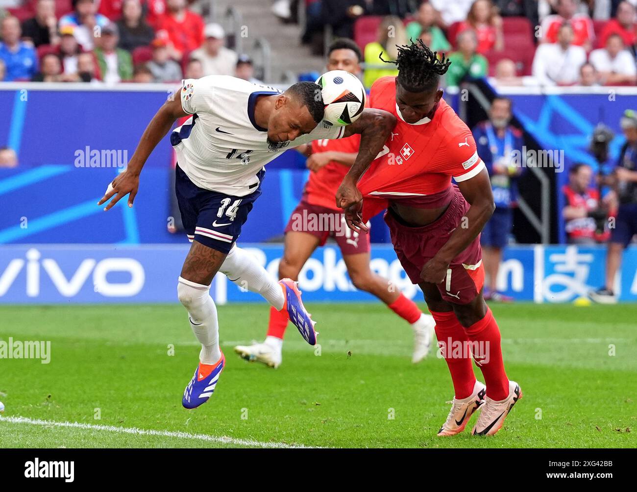 Switzerland's Breel Embolo (right) attempts a headed shot towards goal ...