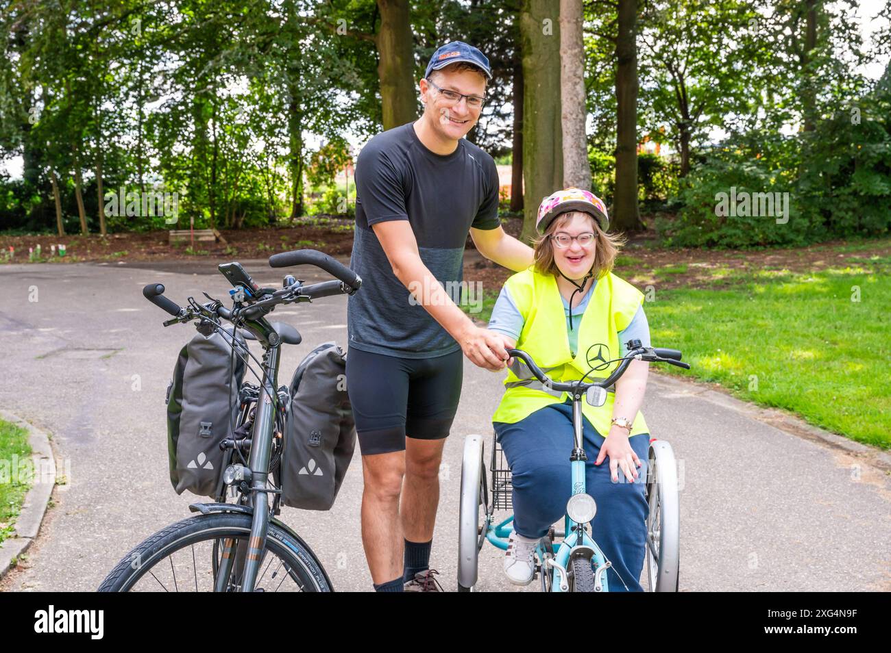 Outdoor portrait of a 40 yo woman with the Down Syndrome and her brother, Drieslinter, Belgium, July 29, 2023. Model released Stock Photo