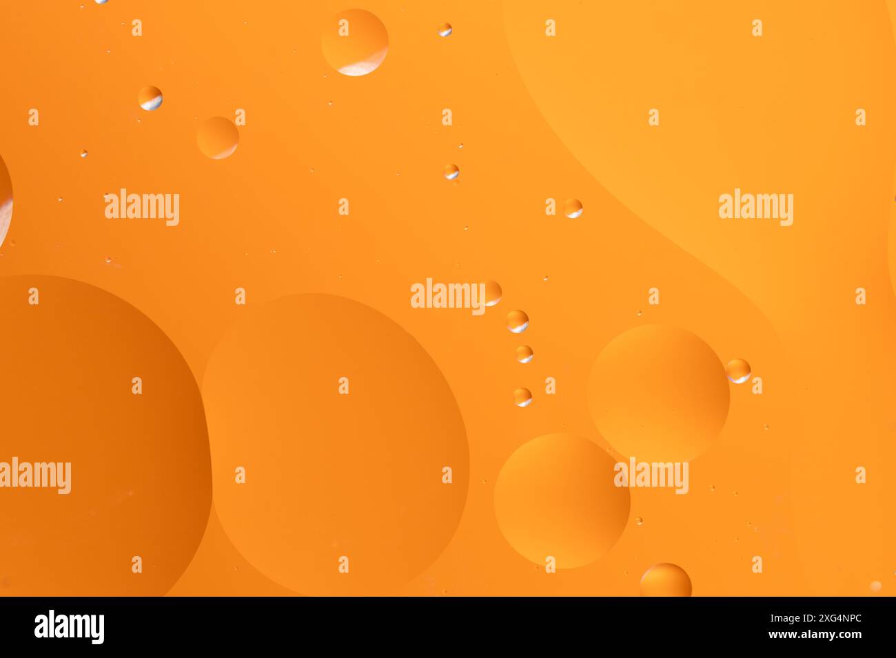 Abstract background with large and small circular shapes in orange ...