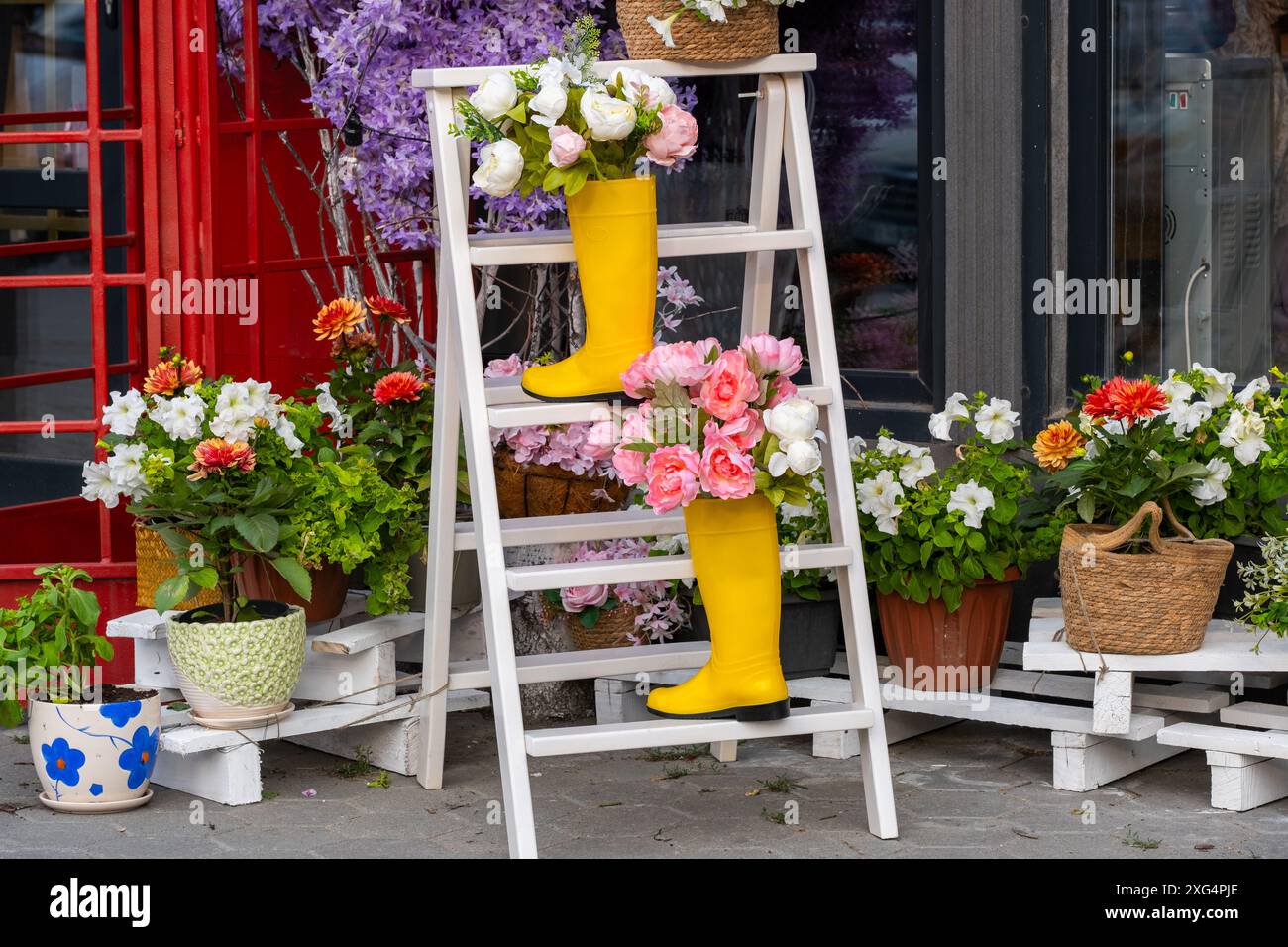 Flower shop in Paris, France. Bouquets flowers in yellow boots Stock ...