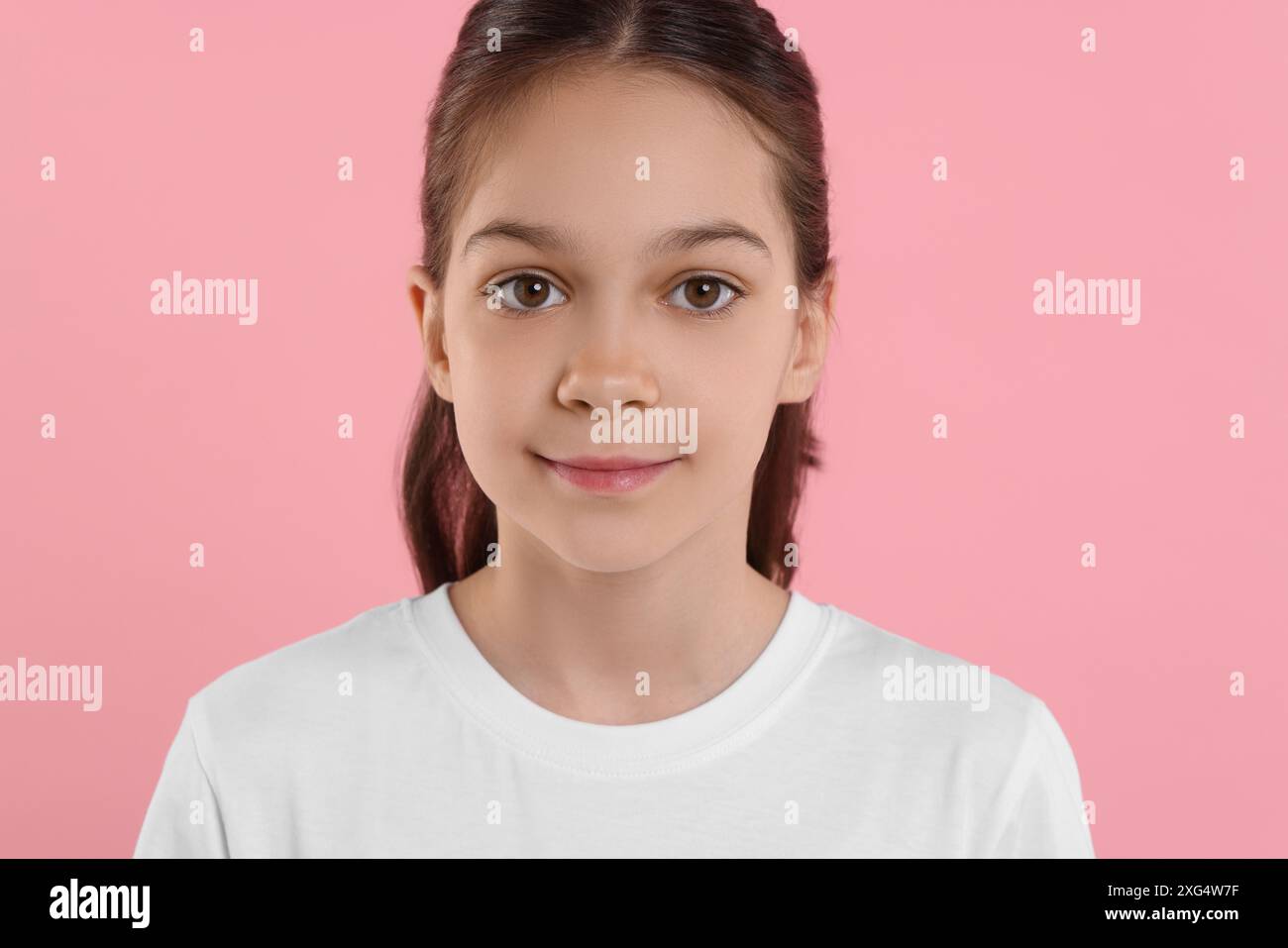 Portrait of beautiful girl on pink background Stock Photo - Alamy