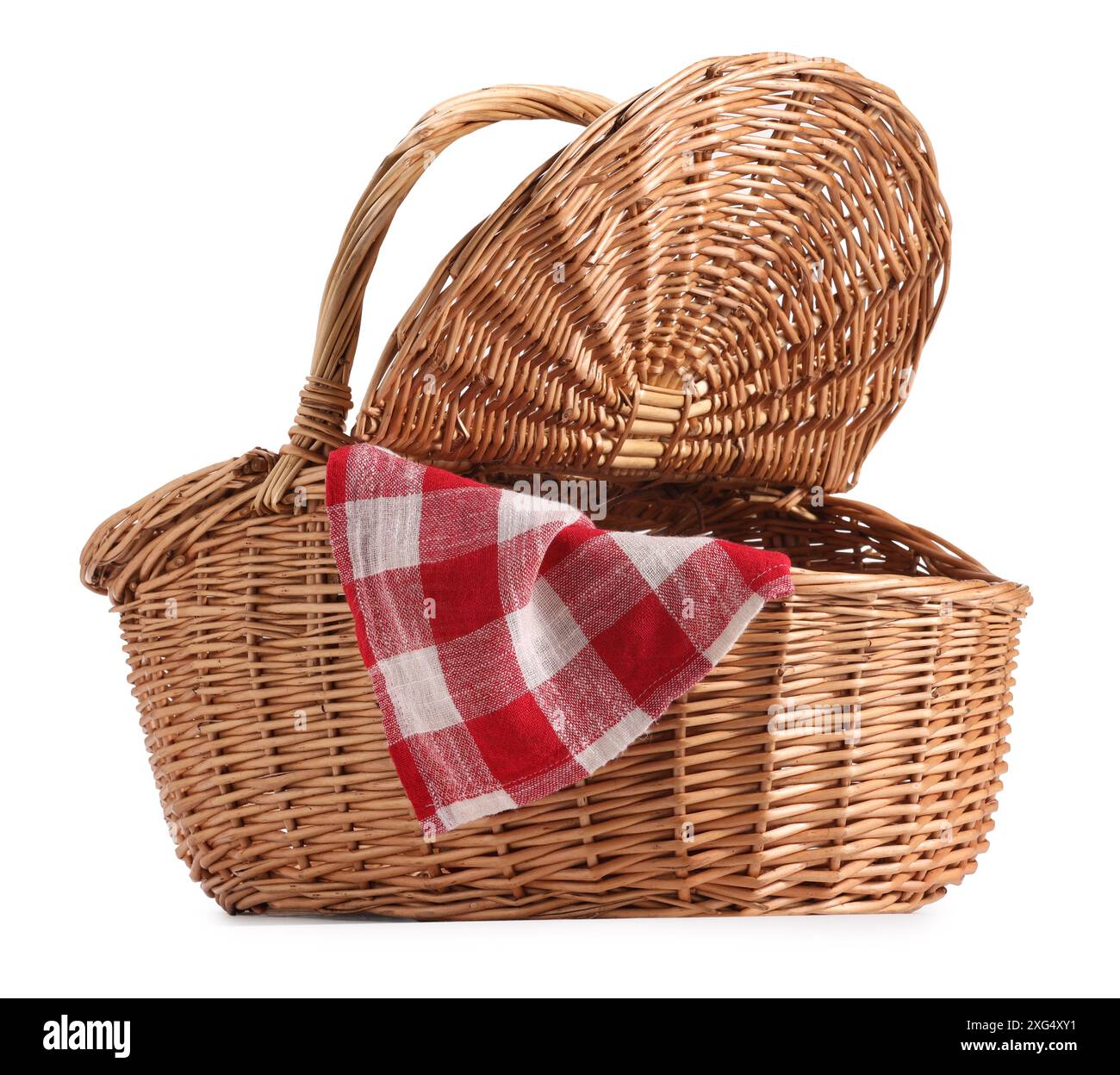 One open picnic wicker basket with checkered napkin isolated on white ...