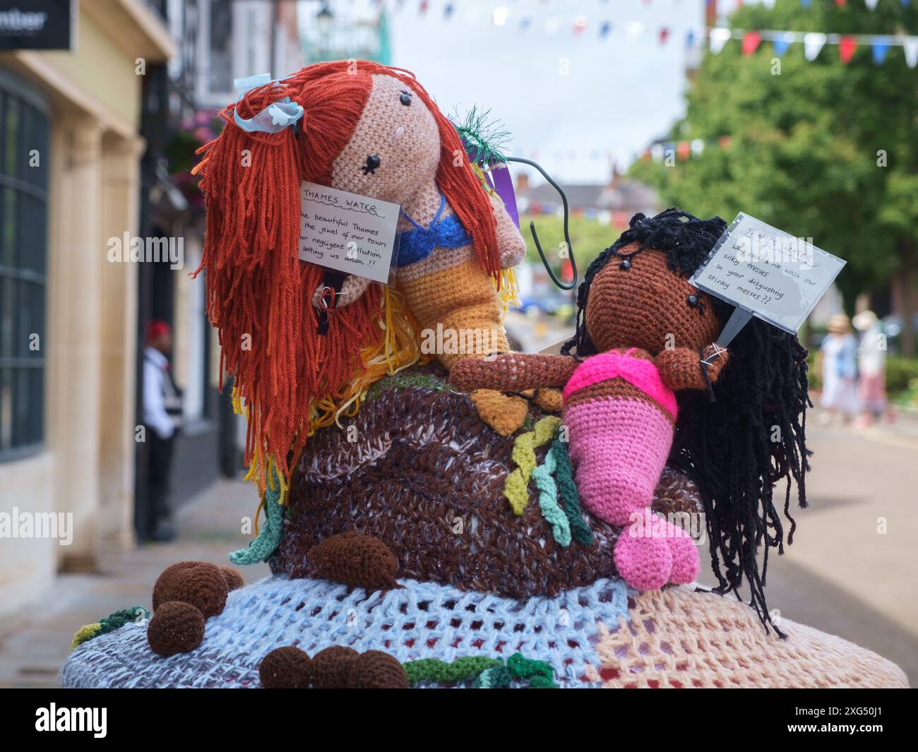 A WI crochet Post Box Topper in Henley-on-Thames town centre inspired by Henley Mermaids protests against Thames Water sewage pollution Stock Photo