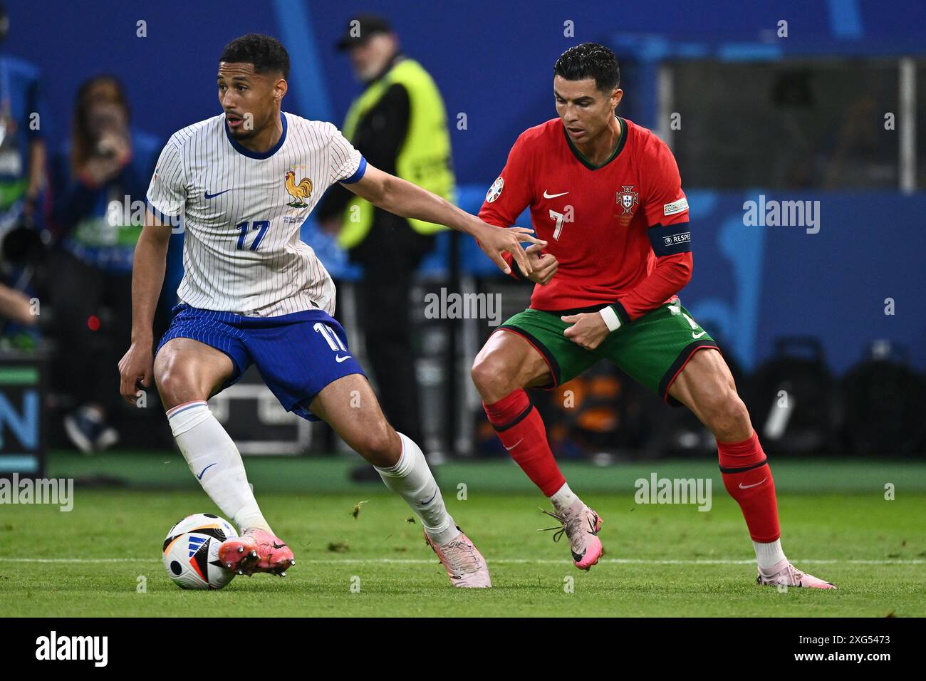 HAMBURG, GERMANY - JULY 5: William Saliba of France and Cristiano Ronaldo of Portugal battle for the ball during the UEFA EURO 2024 quarter-final matc Stock Photo