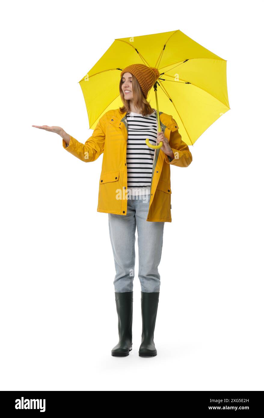 Woman with yellow umbrella on white background Stock Photo - Alamy
