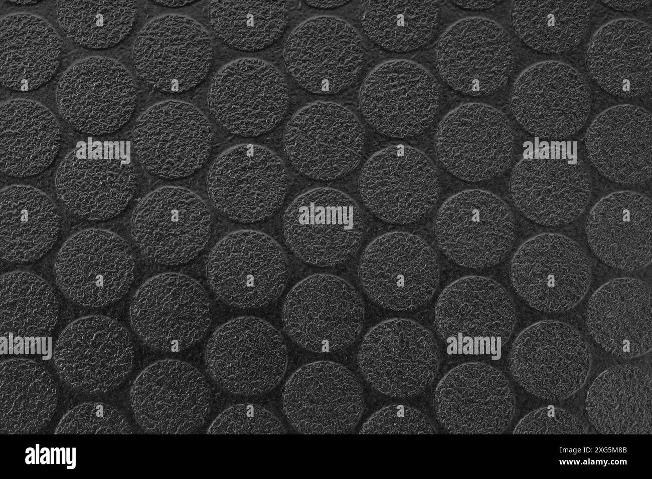 Black textured vinyl background. Dot pattern. Full frame Stock Photo