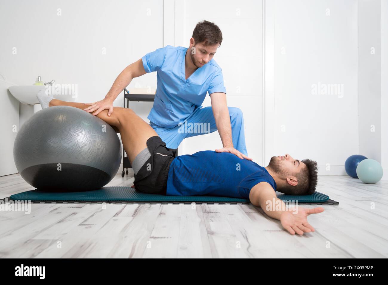 Patient Exercise Physical training exercises help hi-res stock photography and images ...