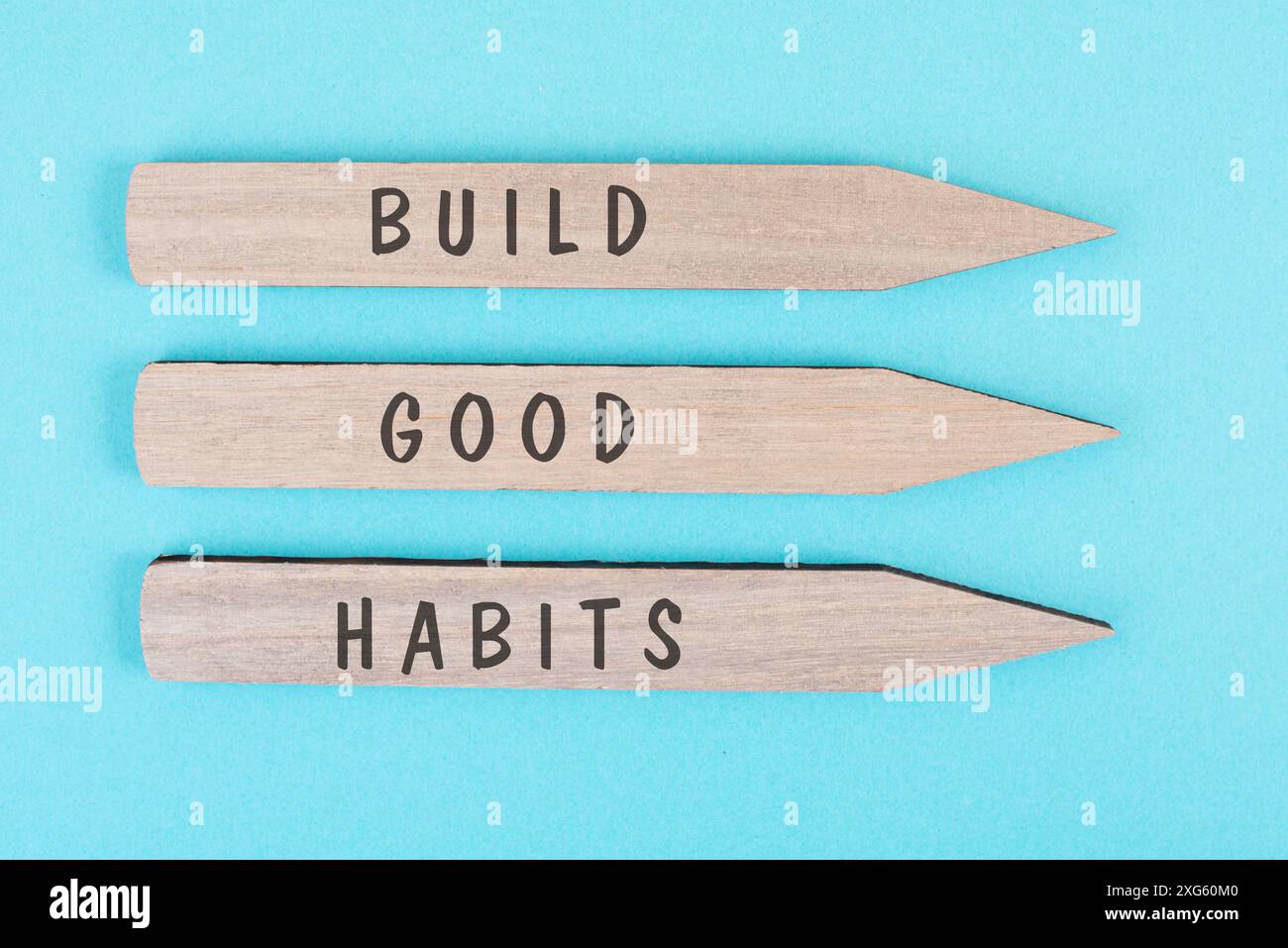 The words build good habits are standing on arrows, change lifestyle, healthy and positive attidude, motivation concept Stock Photo