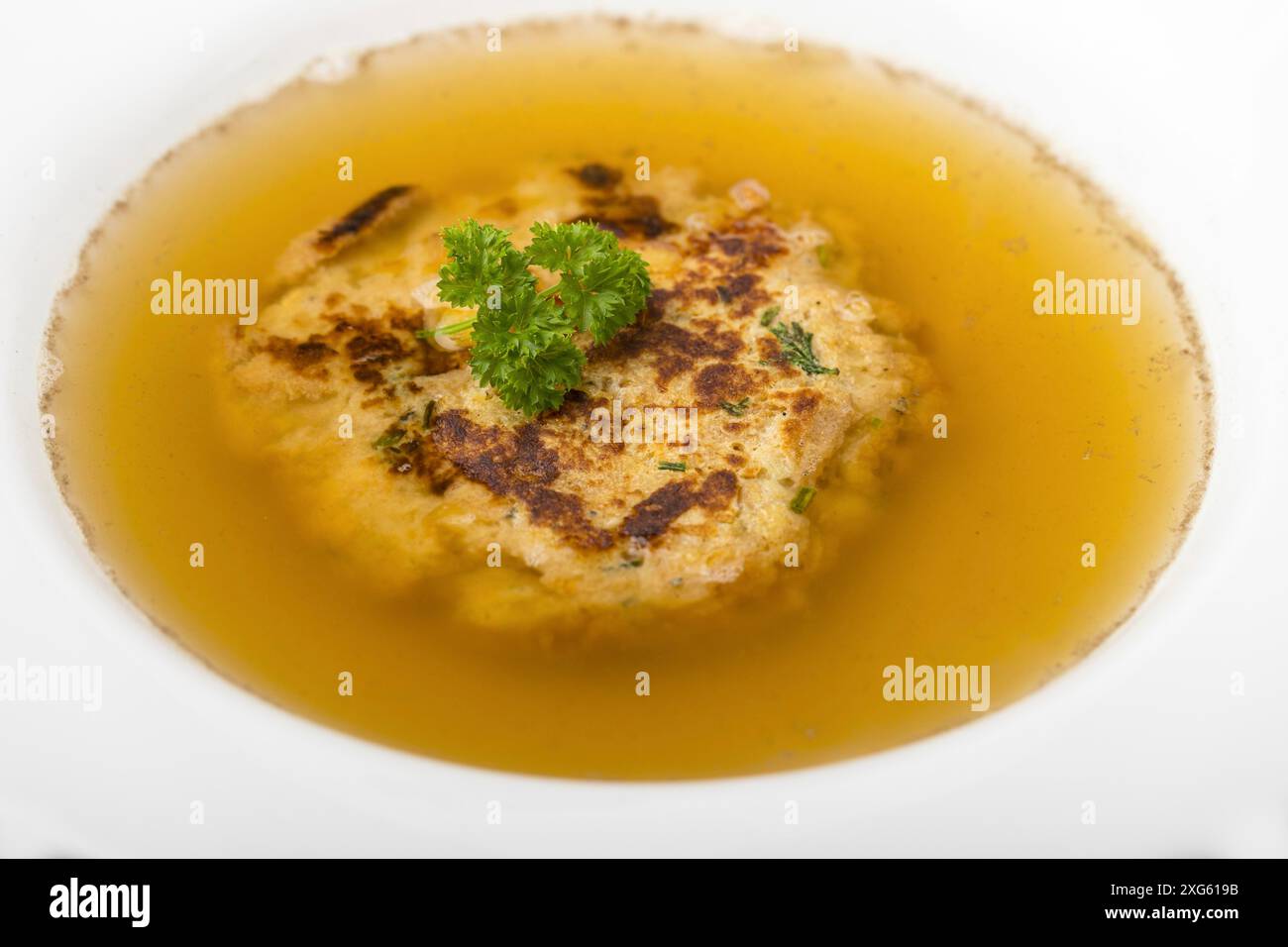 Austrian cheese dumplings in broth Stock Photo