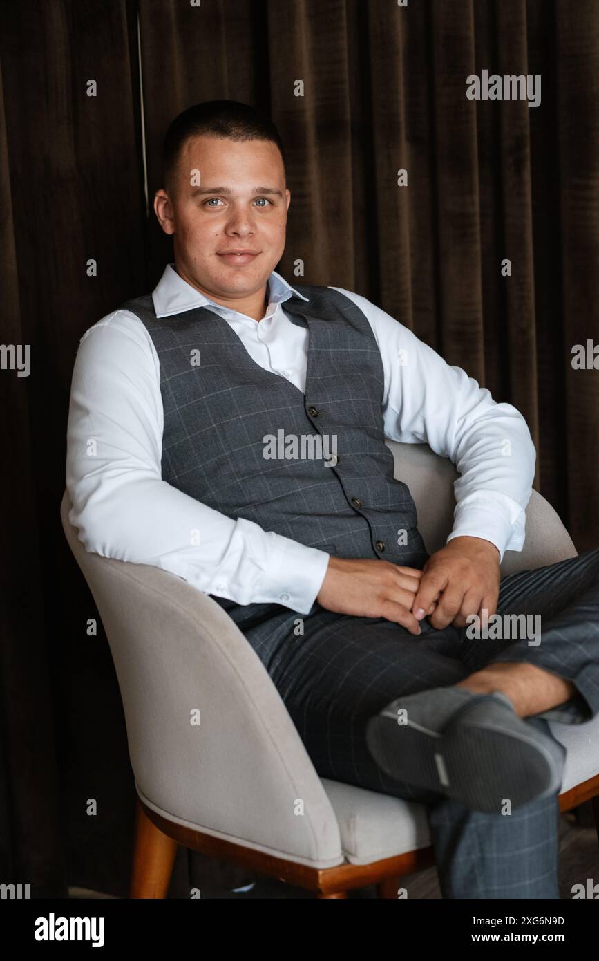 portrait of the groom of a man in the morning before the wedding in a ...
