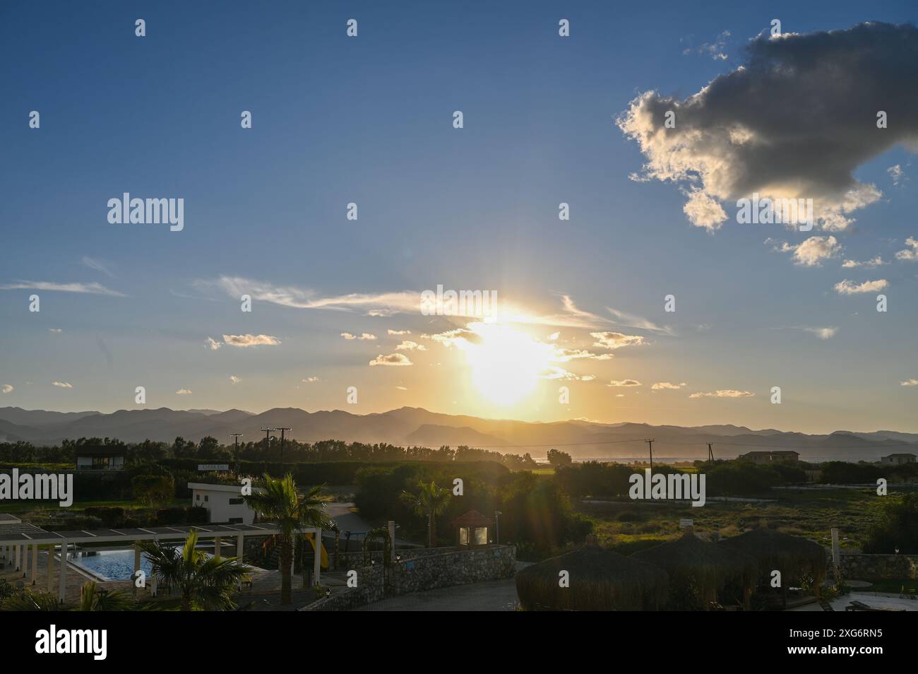 the sun sets behind the mountains in Cyprus 5 Stock Photo