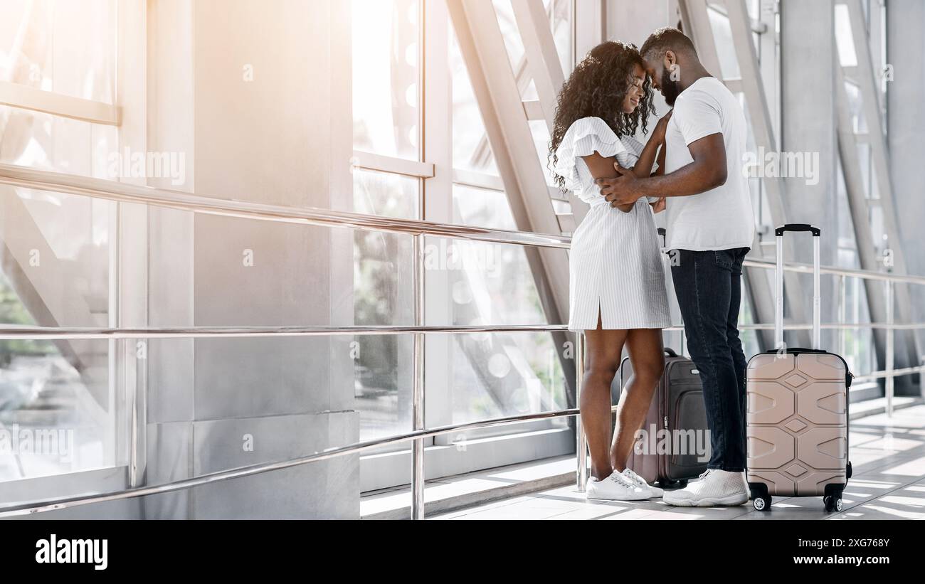 Couple Embraces In Airport Departure Area Before Travel Stock Photo - Alamy
