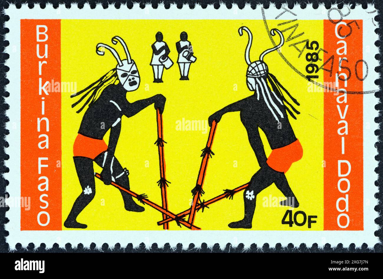 BURKINA FASO - CIRCA 1985: A stamp printed in Burkina Faso from the 'Dodo Carnival' issue shows two dancers and two drummers Stock Photo