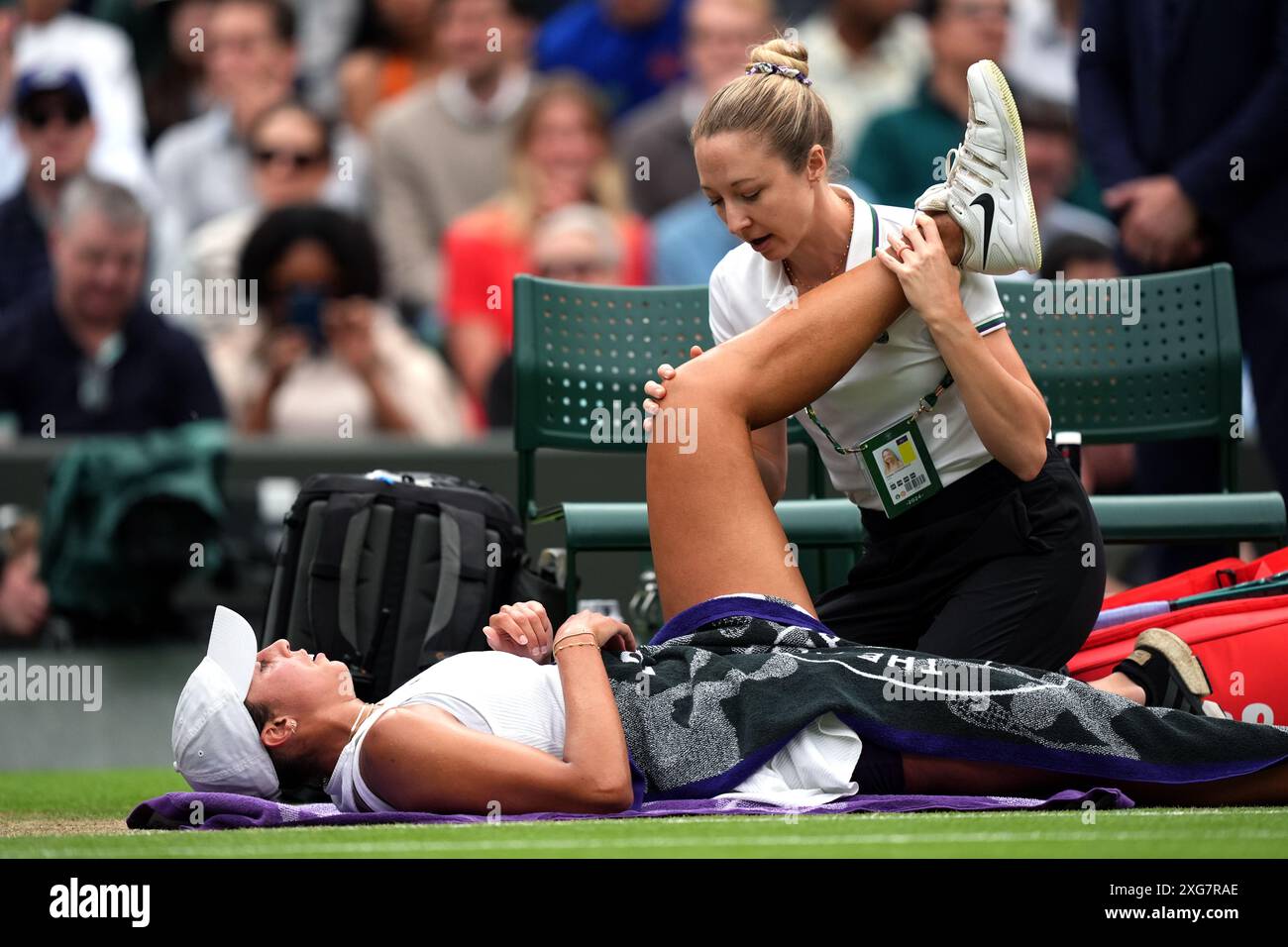Madison Keys receives treatment during her match against Jasmine