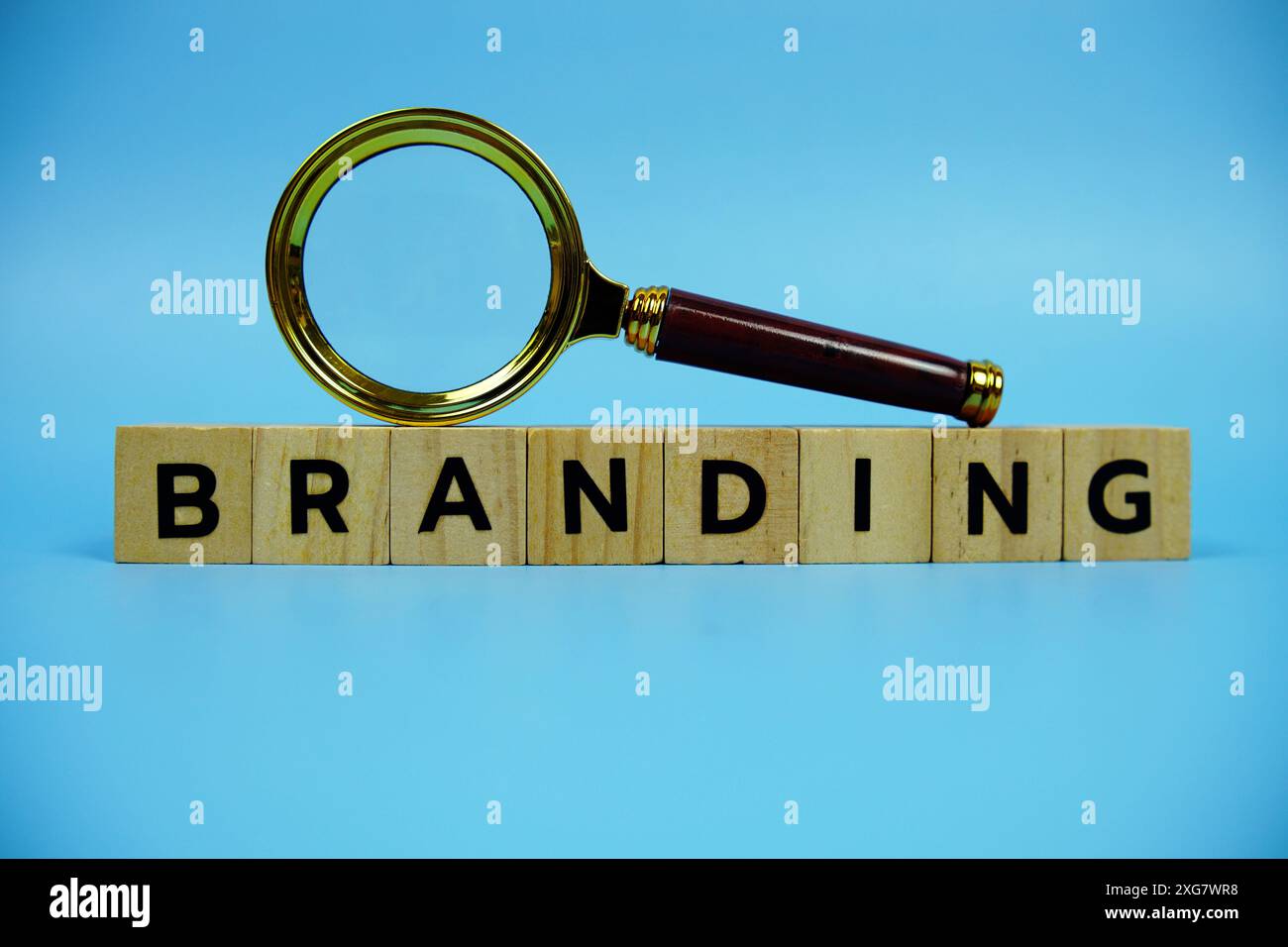 Branding with wooden blocks alphabet letters and Magnifying glass on ...