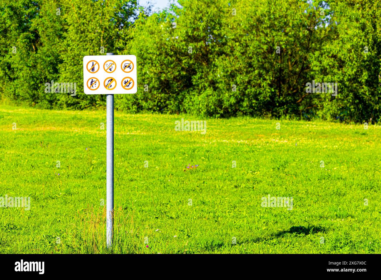prohibitory sign against the background of the park. rules of behavior ...