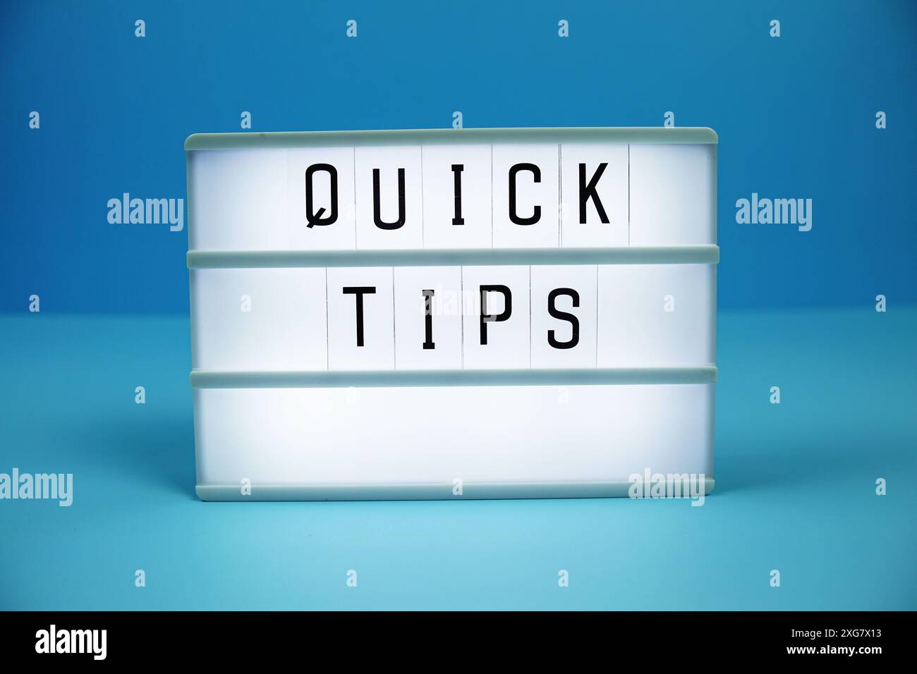 Quick Tips letterboard text on LED Lightbox on blue background Stock Photo