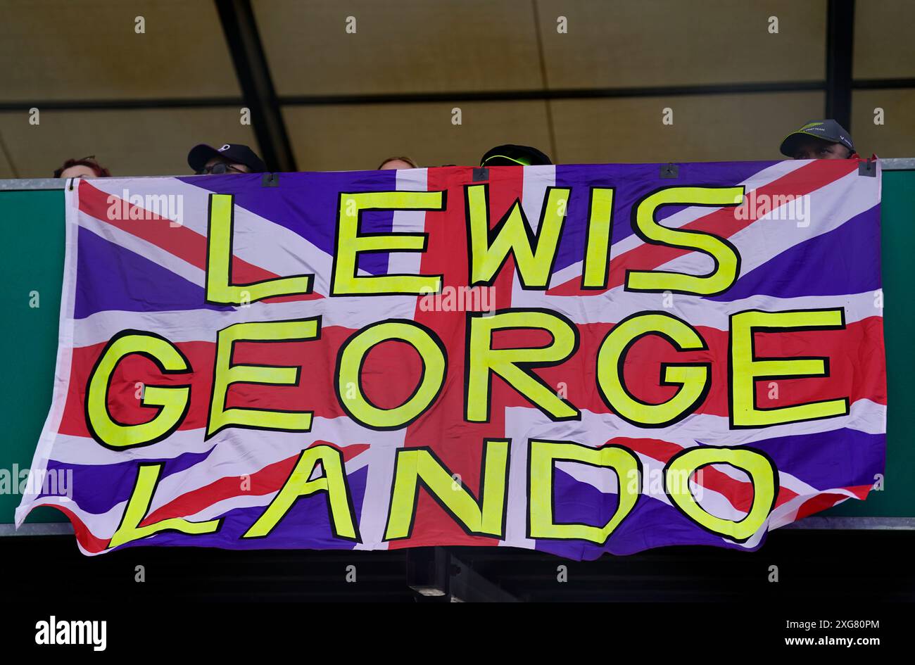 Fans display a Union flag with the names of Mercedes driver Lewis