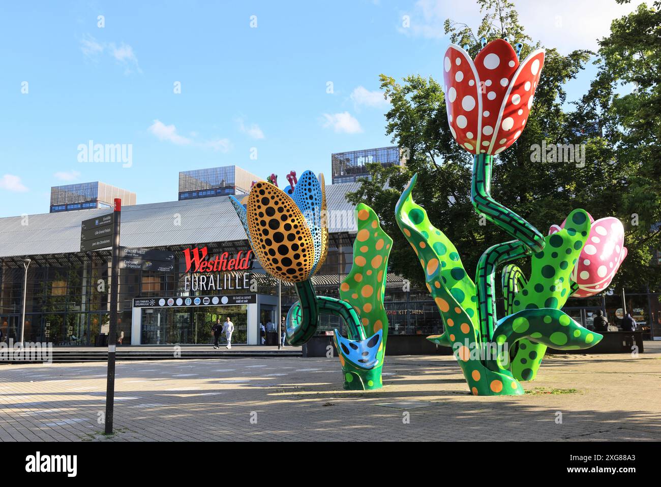 The Tulips of Shangri-La, standing 7 metres high on Place Francois Mitterand. created by Japanese artist Yayoi Kusama & a symbol of the city of Lille. Stock Photo