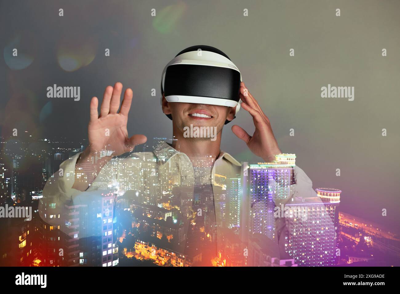 Developer using virtual reality headset in project. Modern technology. Double exposure of man and cityscape Stock Photo