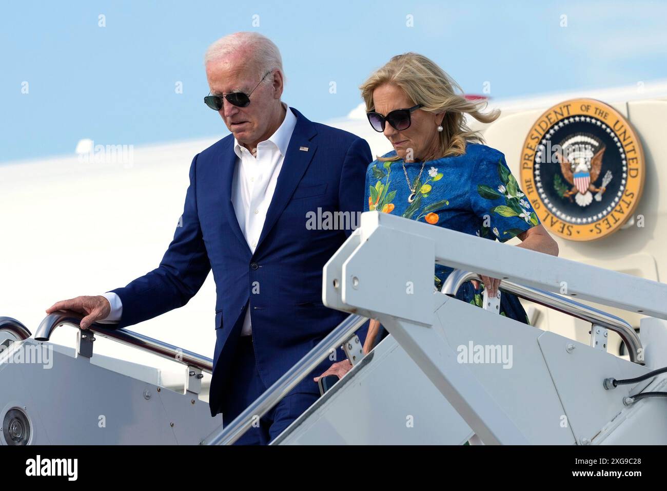 President Joe Biden, left, and first lady Jill Biden disembark Air ...