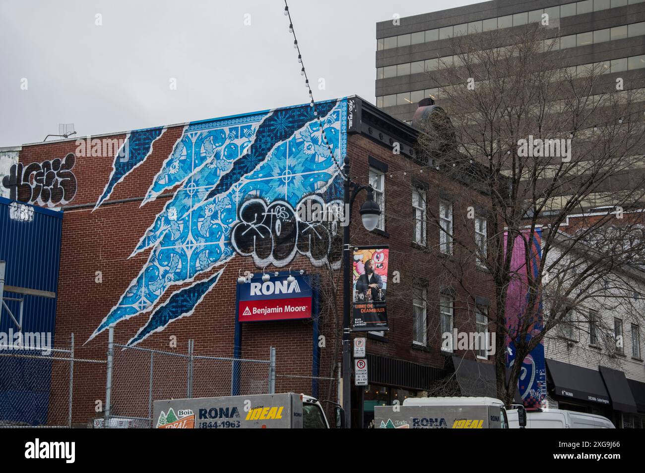 Torn wallpaper mural on Rona Benjamin Moore building on SaintLaurent