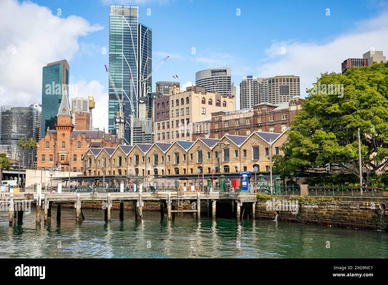 The Rocks precinct and Campbells Cove warehouse stores with Salesforce tower in the background, Sydney city centre with historic Rocks area,Australia Stock Photo
