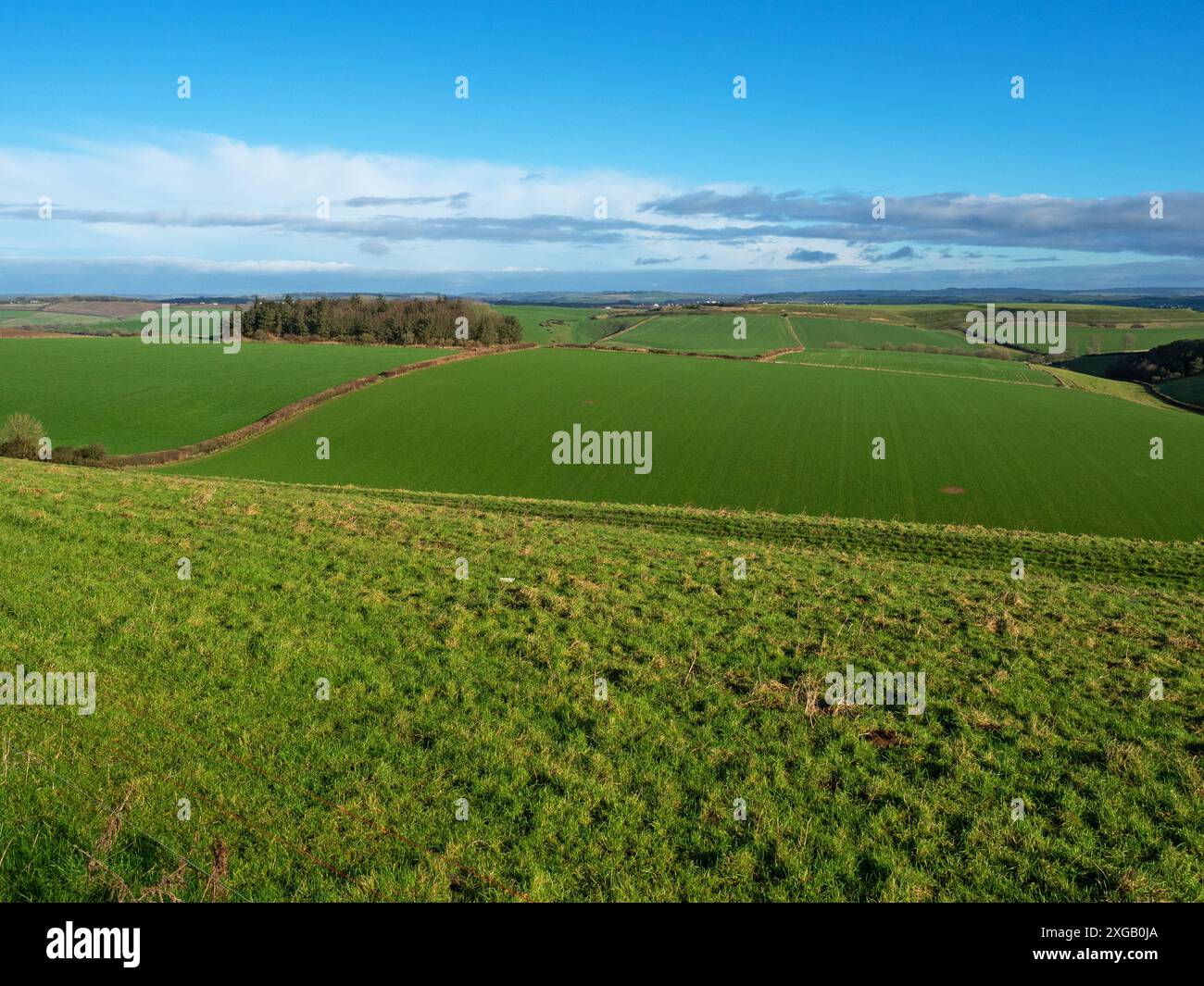 View across farmland towards Dorchester and Maiden Castle, Dorset, England, UK, February 2022 Stock Photo