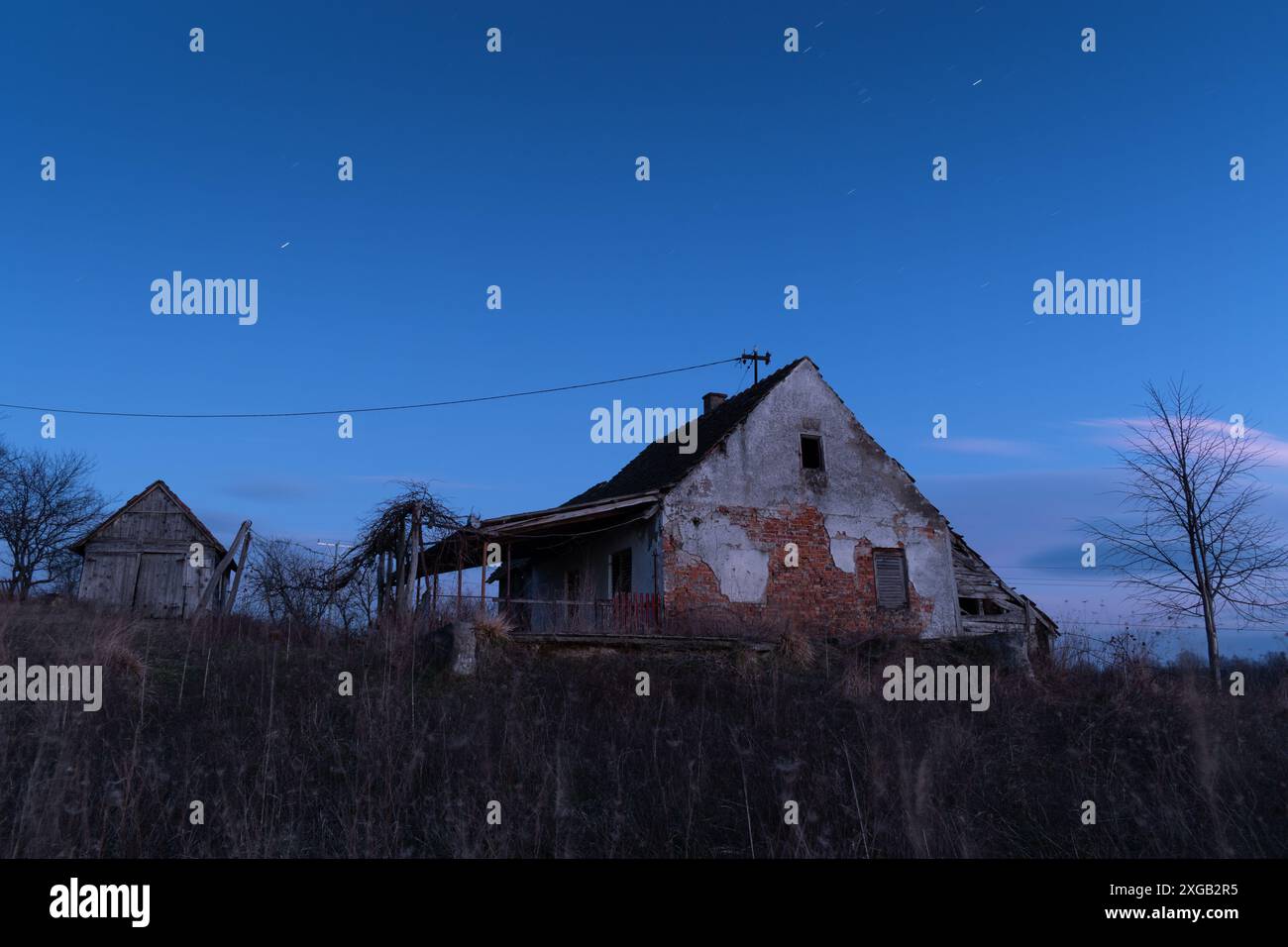 Abandoned farm house against starry night sky, night landscape Stock ...
