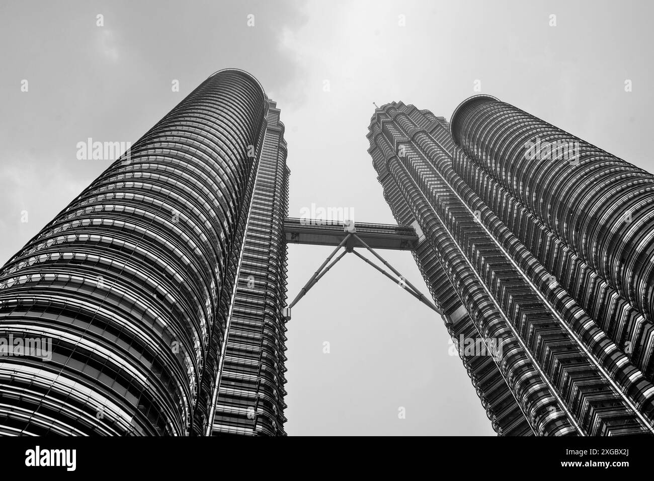 The Petronas Towers, also known as the Petronas Twin Towers, are an interlinked pair of 88-story supertall skyscrapers in Kuala Lumpur, Malaysia Stock Photo