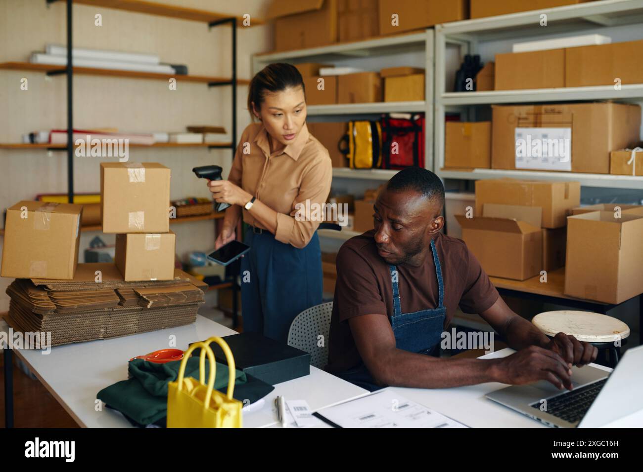 People Working With Goods In Team Stock Photo