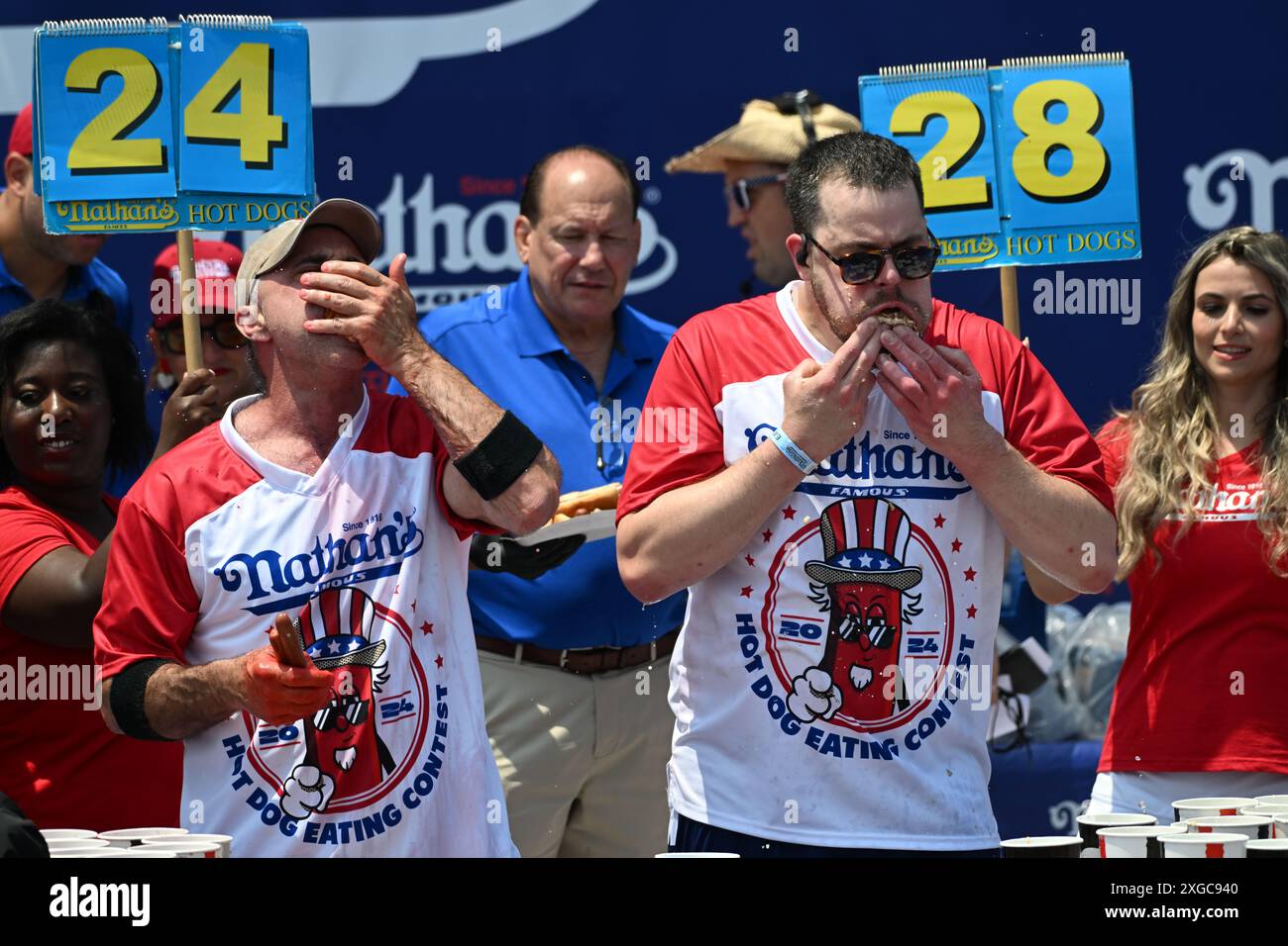 Geoffrey Esper and Patrick Bertoletti  compete in the 2024 Nathan's Famous International Hot Dog Eating Contest at Coney Island on July 4, 2024 in New Stock Photo