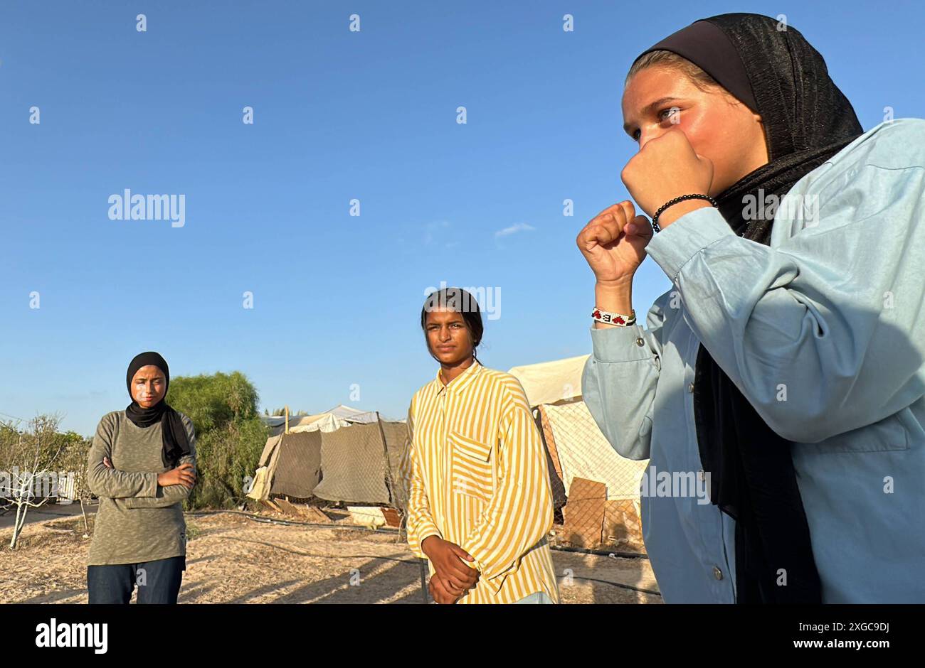 Coach Sami Ayoub trains displaced Palestinian girls in boxing at the displaced persons shelter at Al-Aqsa University Coach Sami Ayoub trains displaced Palestinian girls in boxing at the displaced persons shelter at Al-Aqsa University, west of Khan Yunis, on 08 July 2024. Photo by Abdullah Abu Al-Khair apaimages Khan Yunis Gaza Strip Palestinian Territory 080724 Khan Yunis AKH 007 Copyright: xapaimagesxAbdullahxAbuxAl-Khairxxapaimagesx Stock Photo